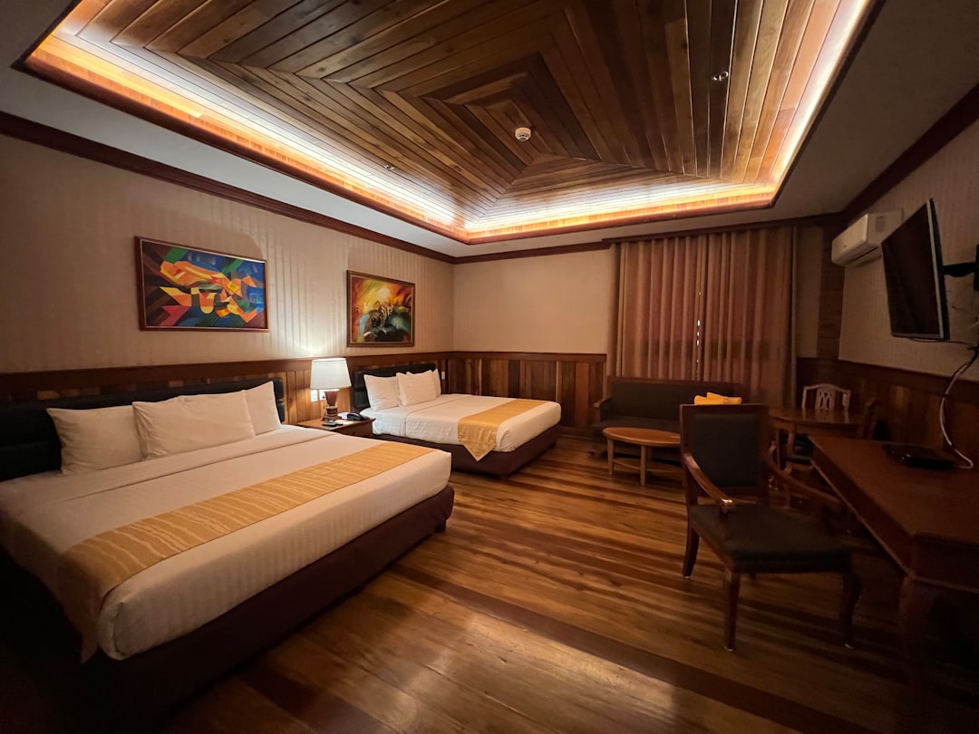 a hotel room with a bed and desk