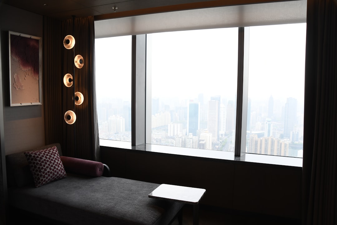 Modern lounge area with city view through large window