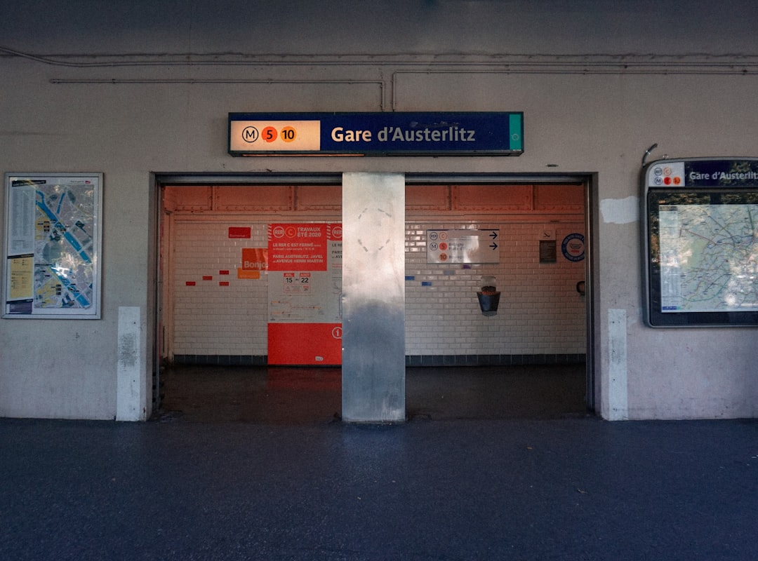 a subway station with a map on the wall