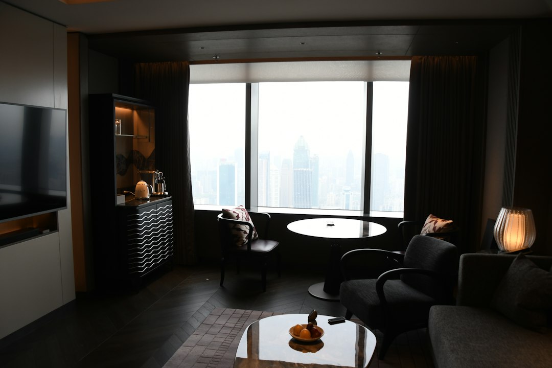 Modern living room with city view through window